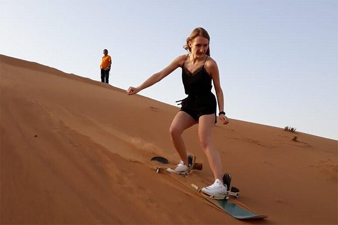 6-Hour Dubai Desert Dinner Safari with Dune Bashing & Camel Ride - Sunset, camel riding, and the camp setting