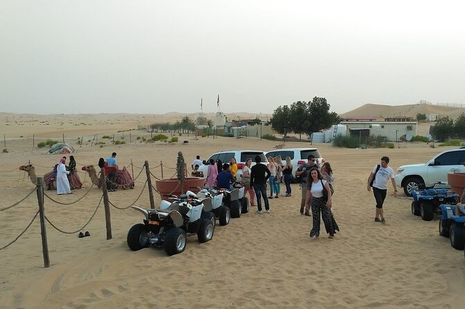 Abu Dhabi: 7-Hours Desert Safari with BBQ, Camel Ride & Sandboarding - Sunset photographs and Bedouin-style camp