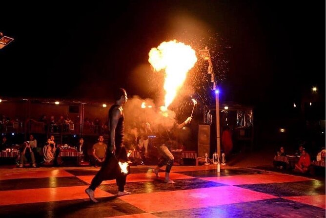 Abu Dhabi Desert Safari BBQ Dinner Live Shows Pick & Drop More - Sunset, sandboarding, and a short camel ride
