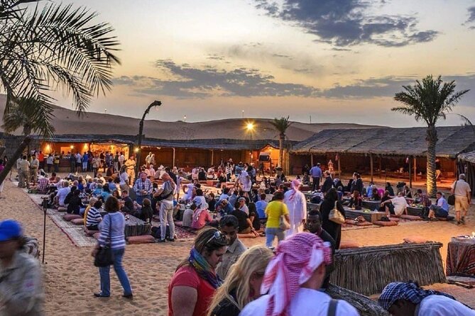 Abu Dhabi Desert Safari BBQ Dinner Live Shows Pick & Drop More - Camp arrival: coffee, sweets, henna, and Arabic dress