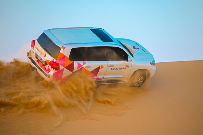 Abu Dhabi Evening Desert Safari - Dune bashing Camel ride and BBQ - Dune bashing in a Land Cruiser