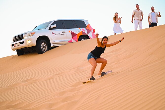 Abu Dhabi Evening Desert Safari - Private car Dune bashing & BBQ - Fire, Tanoura, and belly dance after dark