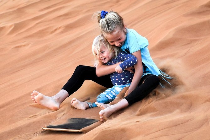 Abu Dhabi: Morning Desert Safari with Camels and Sandboarding - A short camel ride for the classic desert picture