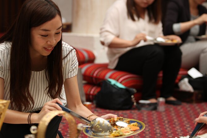Authentic Emirati Cultural Meal and Talk in Old Dubai - Traditional clothing and hands-on details