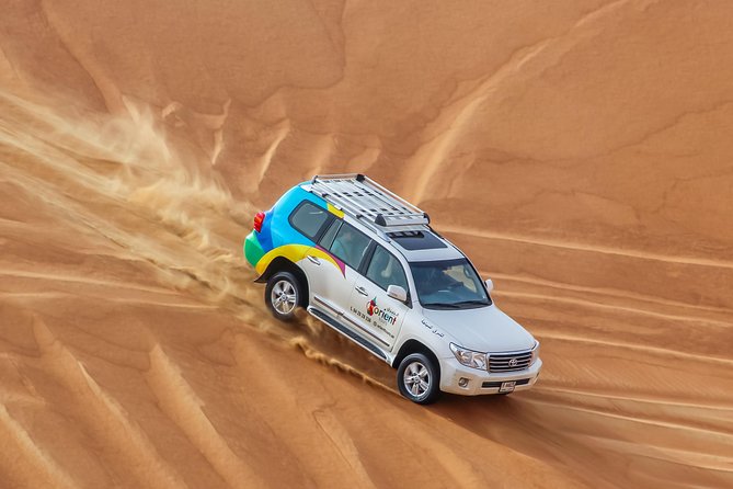 Classic Dubai Desert Safari with BBQ Dinner and Camp activities - Twenty minutes of dune bashing in a 4x4