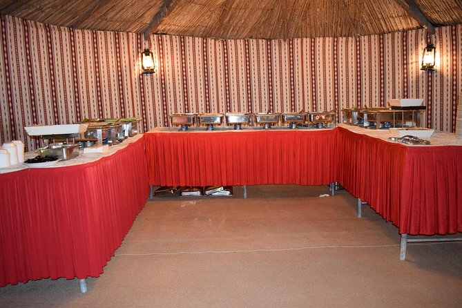 Classic Dubai Desert Safari with BBQ Dinner and Camp activities - A barbecue dinner under the evening sky