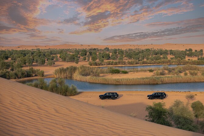 Desert Conservation Wildlife Drive & Breakfast at Al Maha Resort - Traditional dress and the vintage Land Rovers
