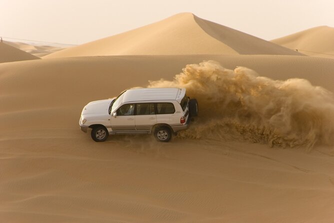 Desert Safari Abu Dhabi w/ Sand Boarding, Camel Ride & BBQ Dinner - Leaving Abu Dhabi for Al Khatim Desert