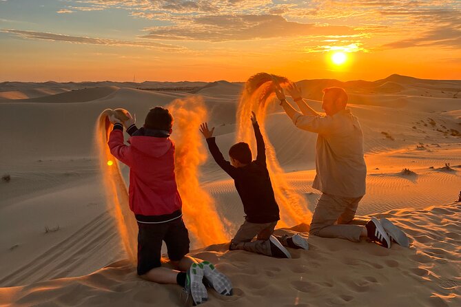 Desert Safari Abu Dhabi w/ Sand Boarding, Camel Ride & BBQ Dinner - Sand boarding and the short camel circuit