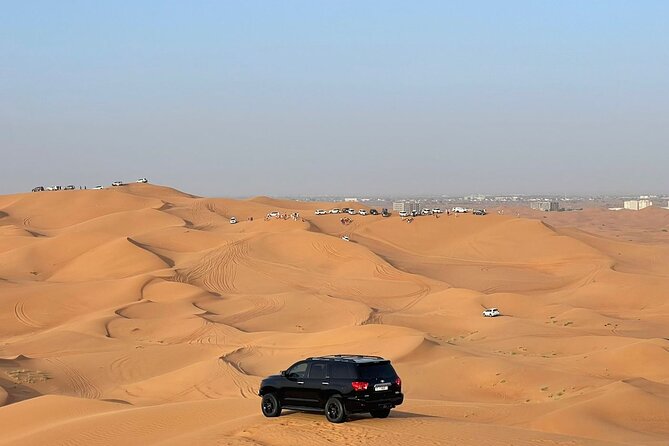 Desert safari adventure with BBQ dinner - Camel riding and sandboarding at the camp