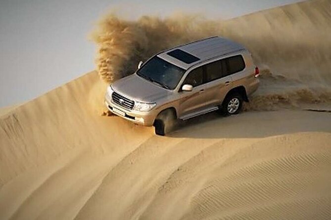 Desert Safari, Camel ride and Inland Sea Tour - Dune bashing across Qatar’s golden sands
