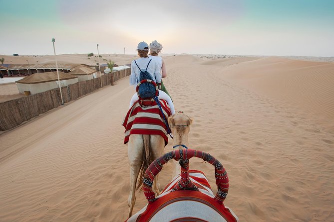 Desert Safari Dubai Adventure With BBQ & Live Shows - Camel rides and sandboarding at the camp