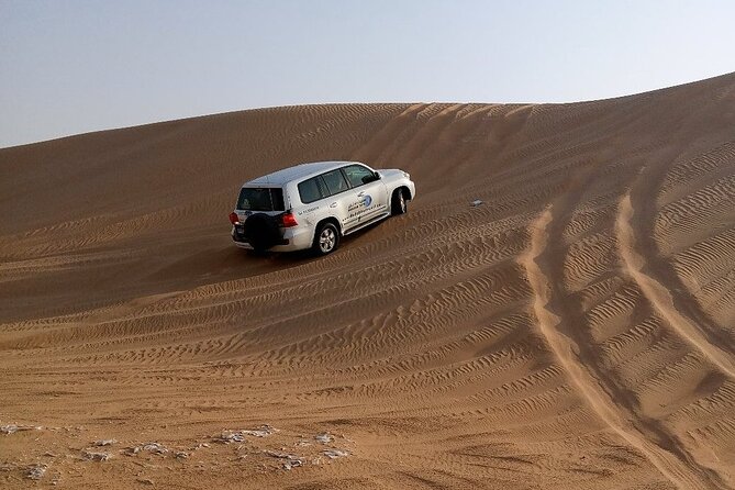 Desert Safari Dubai with BBQ Dinner and Belly Dance - Sunset and photographs in Lahbab