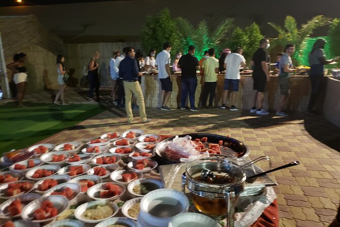 Desert Safari Dubai with Buffet Dinner & 3 live shows - Camel ride, falcon interaction, and camp activities