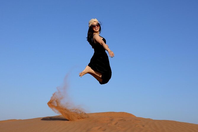 Desert Safari in Dubai - Sand boarding, camel riding, and dune photos