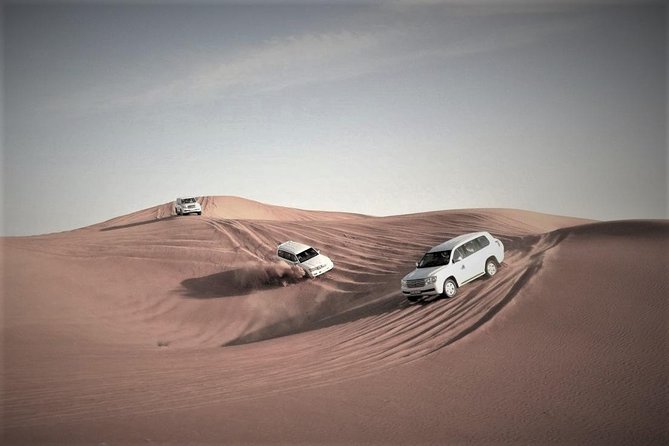 Desert Safari – Morning, Afternoon, Sunrise & Sunset Options - Preparing the 4x4 at the camel camp