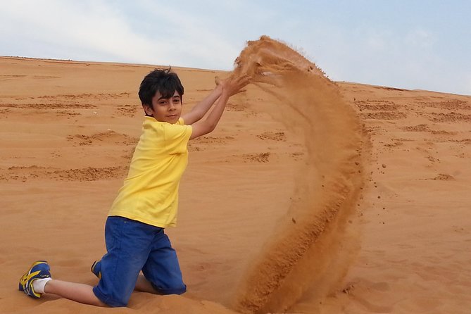 Desert Safari Tour, Quad Bike with BBQ Dinner & Show from Dubai - Sunset photos and sandboarding