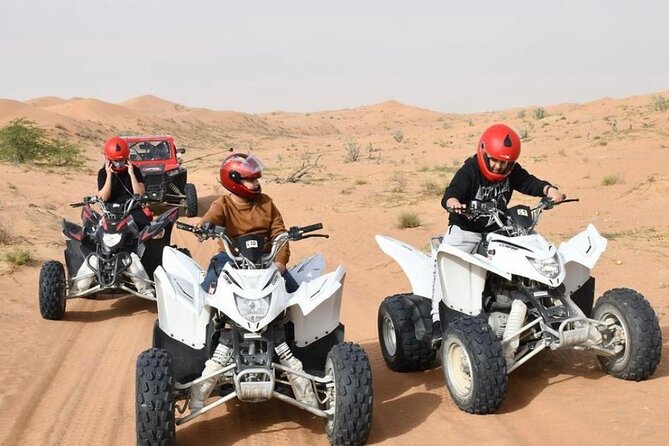 Desert Safari W/BBQ Dinner, Quad Bike, Camel Ride, & Sandboarding - Sandboarding and sunset photographs