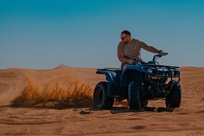 Desert Safari with 30 Minutes Quad Biking on High Red Dunes (Complete Package) - A ten-minute sunset stop on the dunes