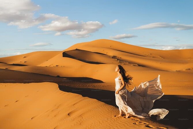 Desert Safari with BBQ Dinner, Camel Ride, Sand Board & Live Show - Camel riding and sandboarding at the camp