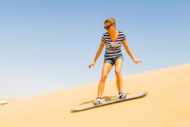 Desert Safari with BBQ Dinner, Camel Ride, Sand Board & Live Show - A short stop before the desert action