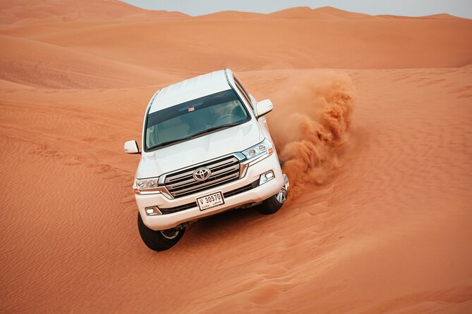Desert Safari with Dune bashing BBQ Dinner and More Activities - Sandboarding and camel riding add variety