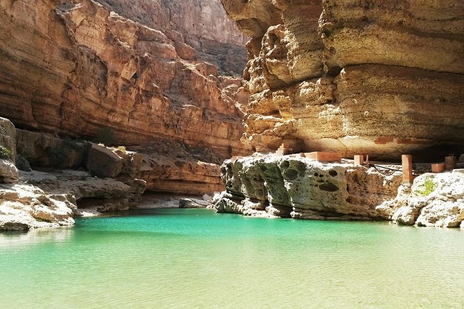 Discover the South and Wadi Shab from Muscat - Bimmah Sinkhole offers a vivid but brief stop