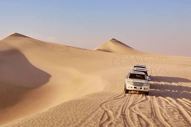 Doha: Desert Safari | Camel ride | Sand-boarding | Quad Biking - Leaving Doha in a shared 4x4