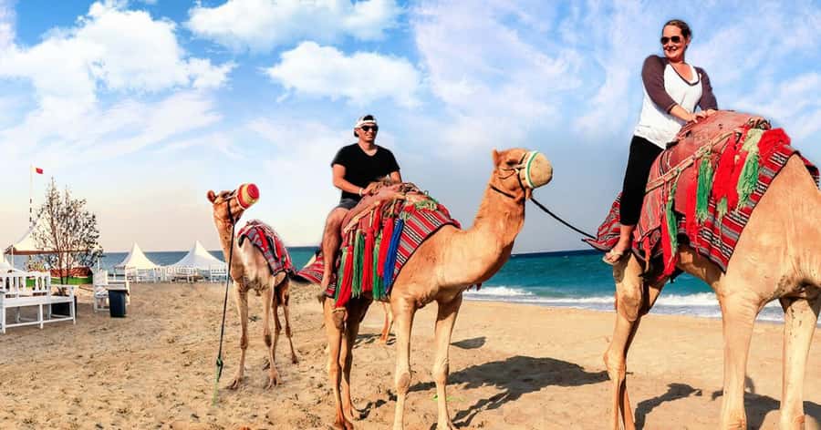 Doha Desert Safari, Camel Ride, Sandboarding & Inland Sea - Sandboarding on Qatar’s golden dunes