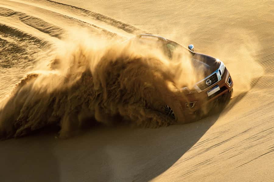 Doha Desert Safari: Sandboarding, Camel Ride & Swimming Fun - Khor Al Adaid, where the sand reaches the Gulf