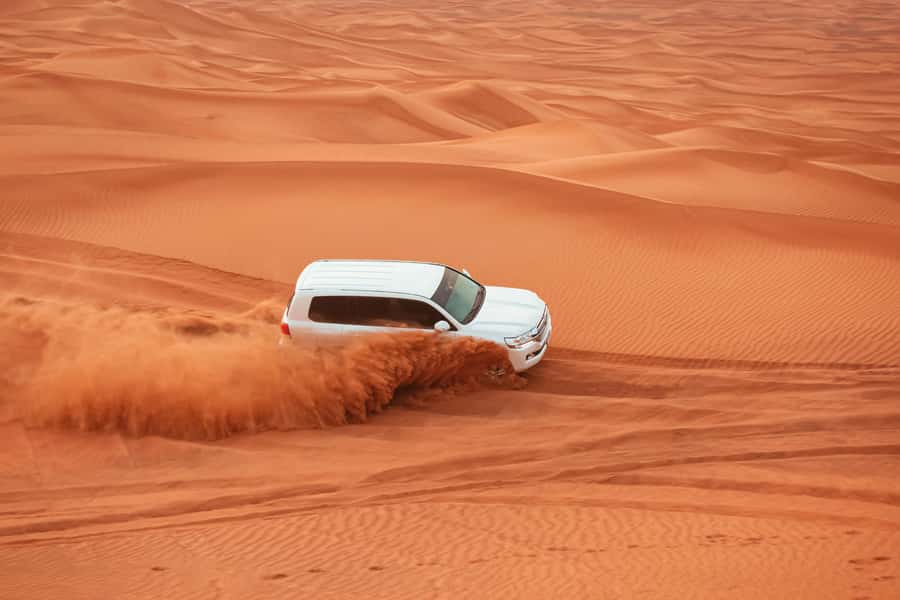 Doha: Desert Safari, Sandboarding, Dune Bashing & Inland Sea - Dune bashing across Qatar’s sand