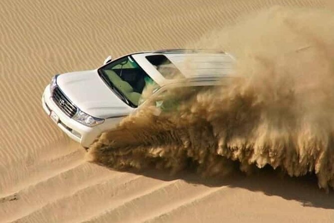 Doha: Half Day Desert Safari with Camel Ride and Inland Sea Tour - Dune bashing across Sealine Beach