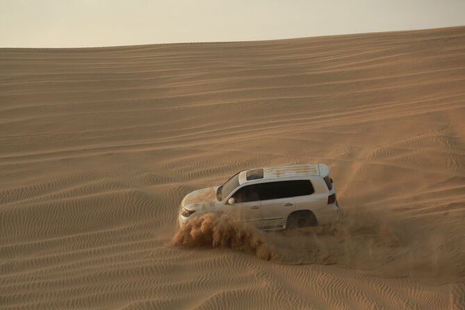 Doha: Half Day Desert Safari with Camel Ride and Inland Sea Tour - Sandboarding without a long lesson