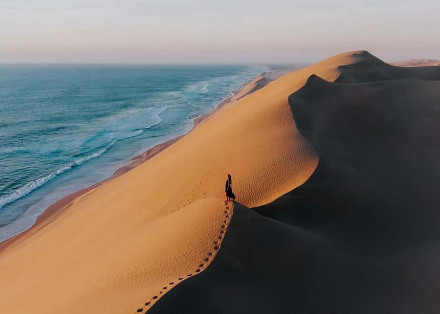Doha: Inland Sea Desert Safari with Sunset & Sunrise Views - The first desert stop: tea, photos, and optional activity time