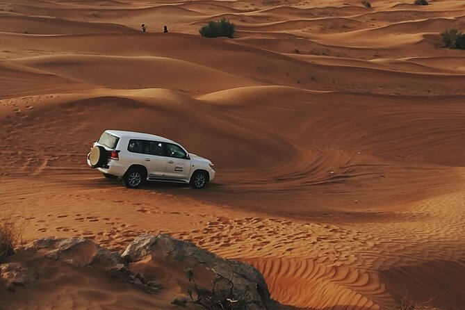 Doha Private Half-Day Guided Desert Safari Tour - Dune driving across the golden sand