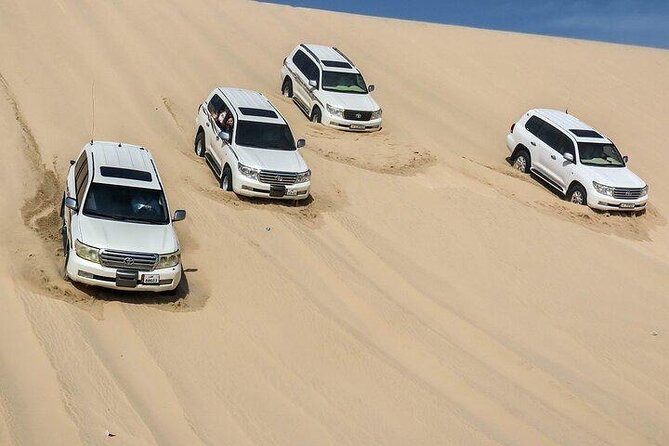 Doha Qatar ATV Quad Bike Buggy Desert Adventure and Camel Ride - Dune bashing at Sealine Beach