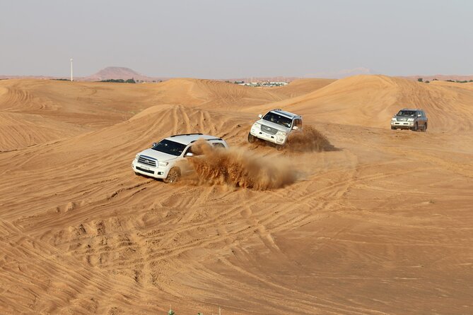 Doha Sharing Desert Safari with Dune Bashing and Sand Boarding - Dune bashing across the open sand