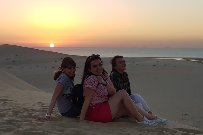 Doha: Sunrise /Sunset Desert Safari with Sand Boarding,Camel ride - Sealine Beach: tea, camels, and a change of pace