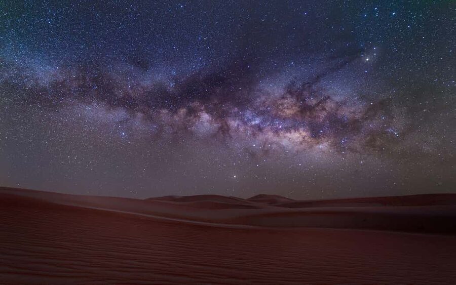 Doha: Sunset Desert Safari, ATV, Camel Ride and Sandboarding - Sandboarding Down a Soft Dune