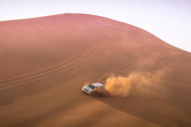 Doha: Sunset Desert Safari, Camels, Sandboarding & Inland Sea - Dune bashing: the loud, thrilling middle of the trip
