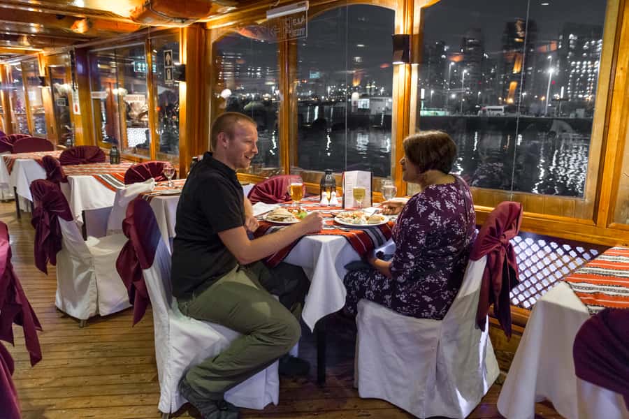 Dubai: 2-Hour Evening Dhow Cruise and Dinner - Dubai after sunset, from the water