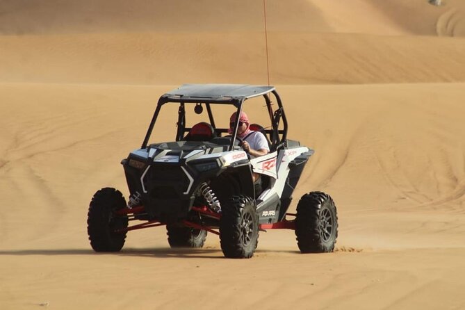 Dubai Buggy Tour in red sands and Desert Safari - Driving a Polaris RZR across the dunes