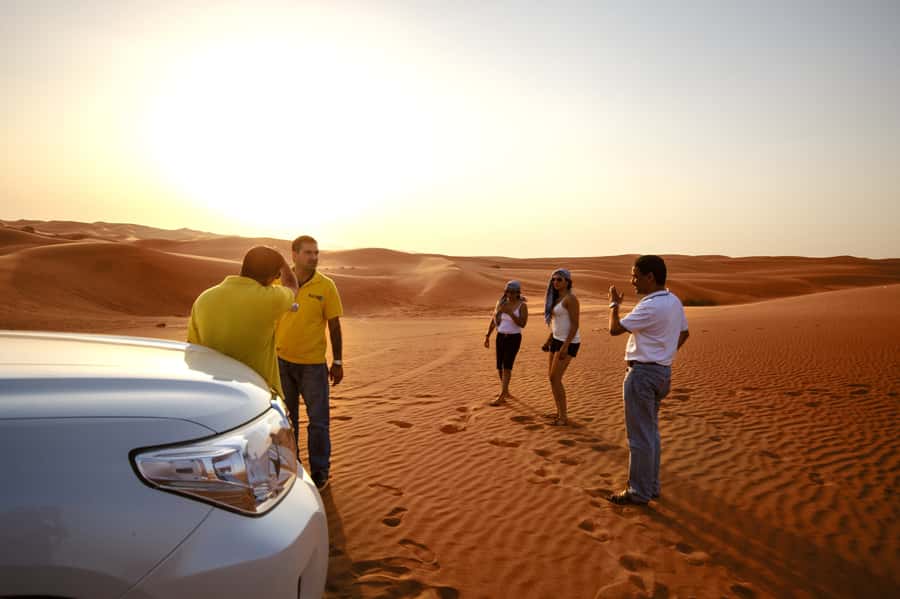 Dubai Cityscape and Desert Safari Full-Day Tour - Camel riding and sandboarding at the camp