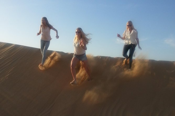 Dubai Desert Afternoon Quad Safari with Camel Ride, BBQ Dinner and Belly Dancing - BBQ dinner and desert entertainment