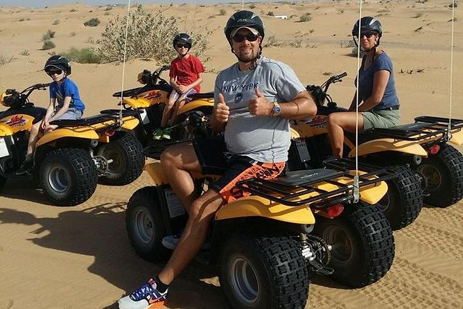 Dubai Desert Afternoon Quad Safari with Camel Ride, BBQ Dinner and Belly Dancing - The quad-bike ride is the star