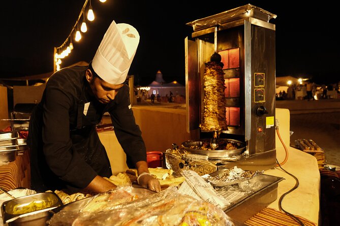 Dubai Desert Camp Dinner with BBQ, Dinner, Camel Ride & Shows - Belly dancing, Tanura spinning, and the fire show