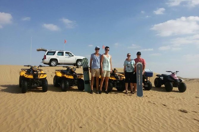 Dubai Desert Morning Tour in 4WD Vehicle: Camel Ride, Quad Bike Tour, Sandboarding, and Camel Farm - Quad biking across the dunes