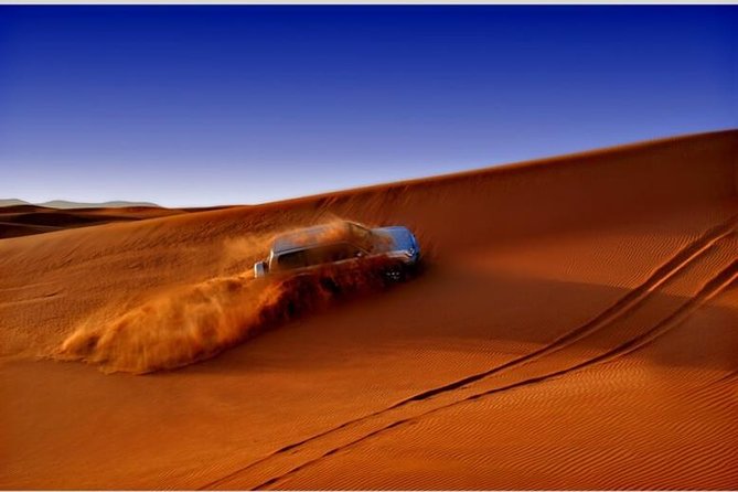 Dubai Desert Red Dune Half-Day Safari Adventure and BBQ Dinner - Belly dance, tanoura, and fire performances