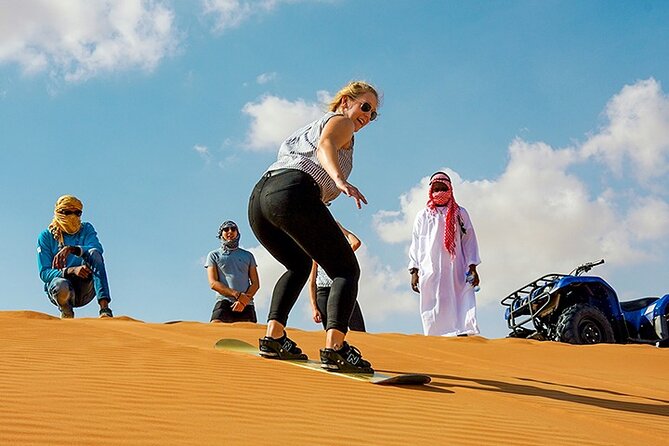 Dubai Desert Safari Adventure, 60mins ATV, Camel Ride, Shows, BBQ - ATV riding across the sand