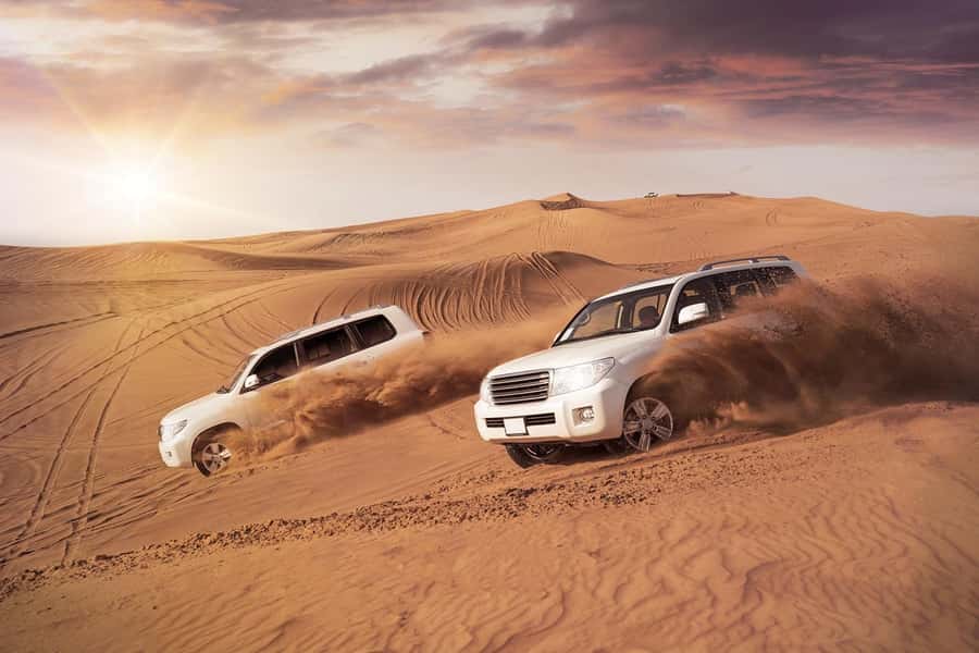 Dubai: Desert Safari, Camel Ride, and BBQ Dinner - Sunset over the dunes